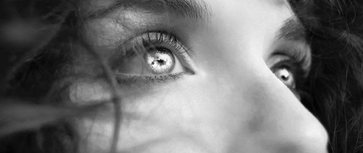 Black and white picture of woman with metallic colored eyes