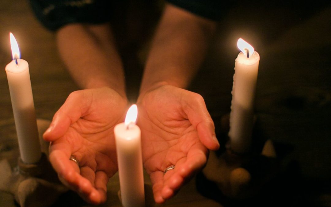 hands and candles