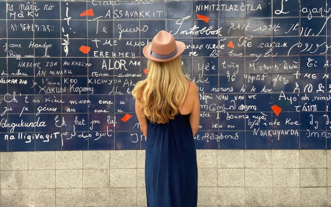 diana hill looking at wall with love in different languages
